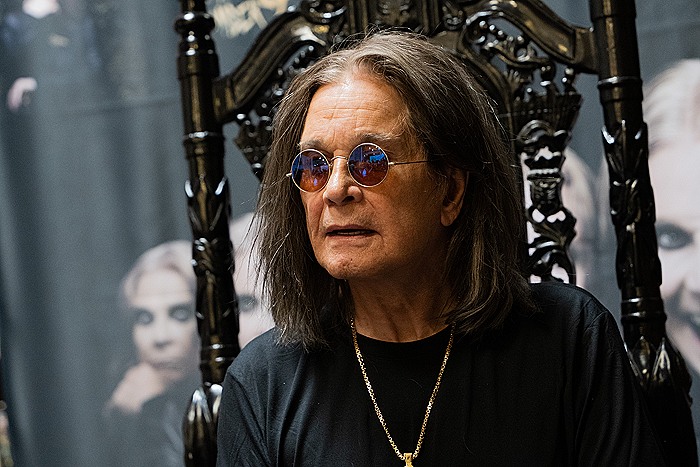 LONG BEACH, CALIFORNIA - SEPTEMBER 10: Musician Ozzy Osbourne signs copies of his album 
